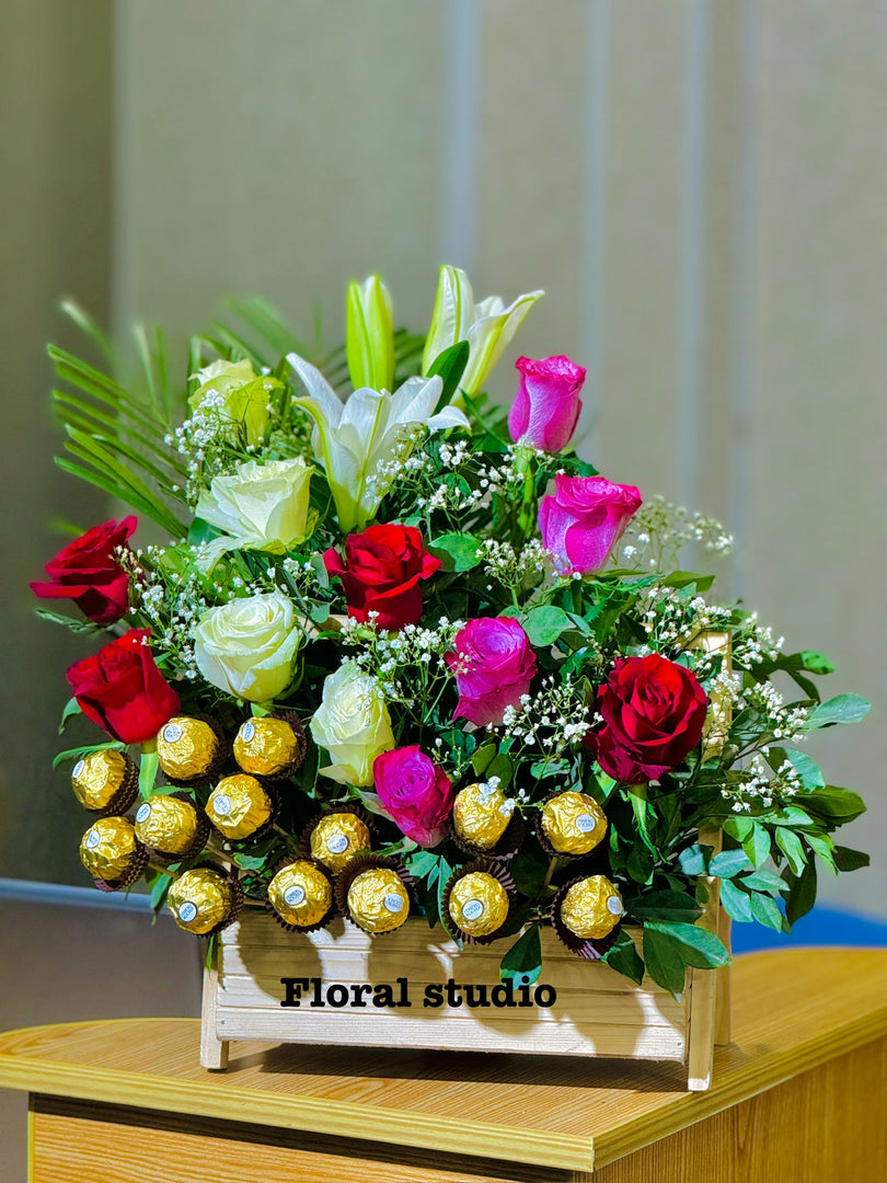 Chocolate Harmony bouquet with roses, lilies, and Ferrero Rocher chocolates