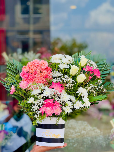 Pink Horizon bouquet with pink roses, white roses, chrysanthemums, and baby’s breath
