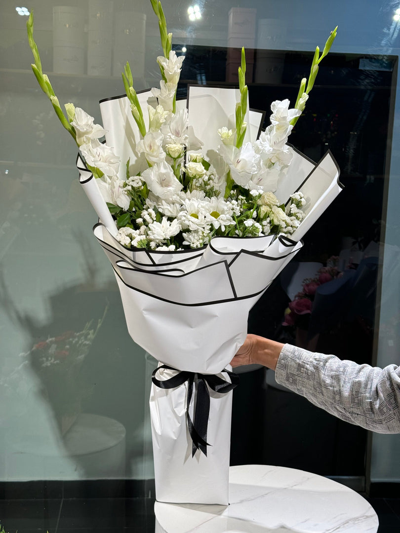 Whisper Bloom bouquet with spry roses, chrysanthemum, gypso, and gladiolus