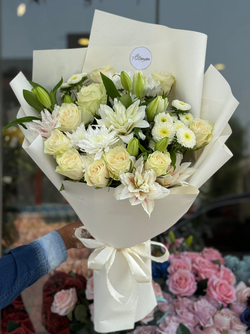 White Peace bouquet with white roses, lilies, chrysanthemums and dahlias