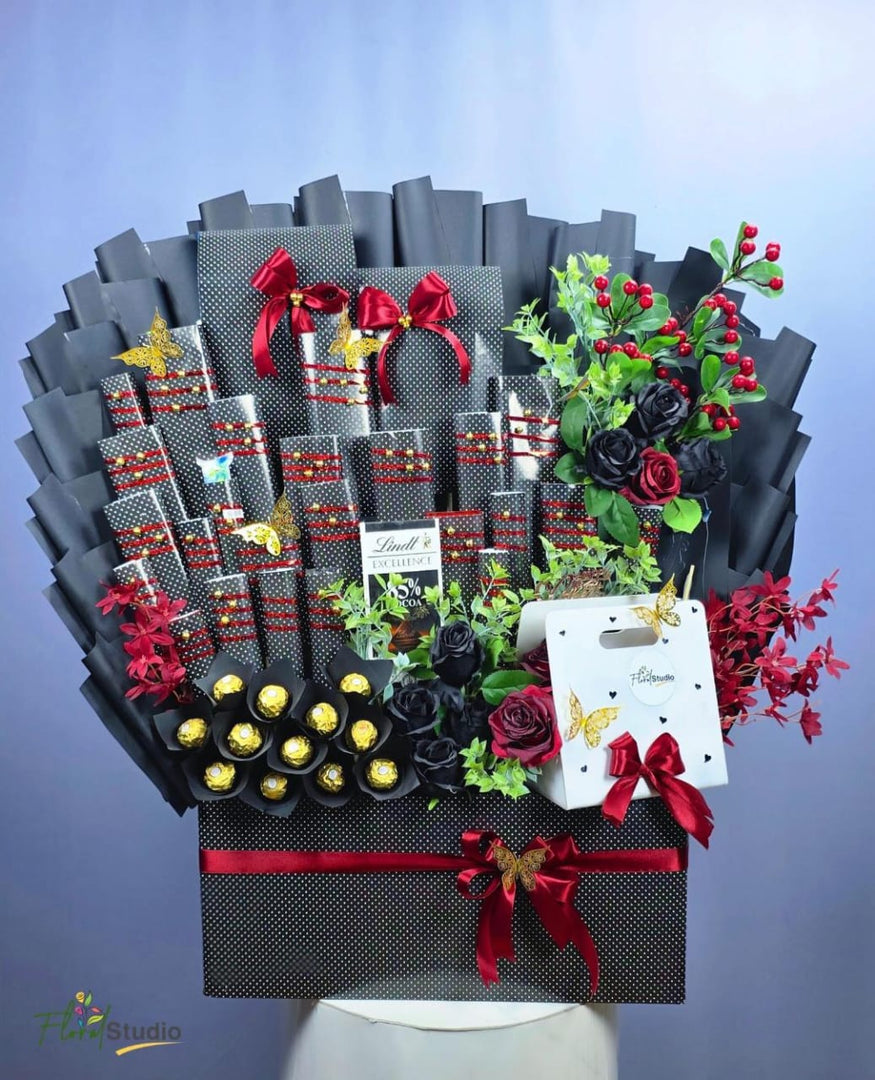 Grand Luxury Gift Hamper with Ferrero Rocher, Lindt, Dairy Milk, KitKat, Bounty, Mars, Snickers, black and red roses — delivery in Lahore, Karachi, Islamabad