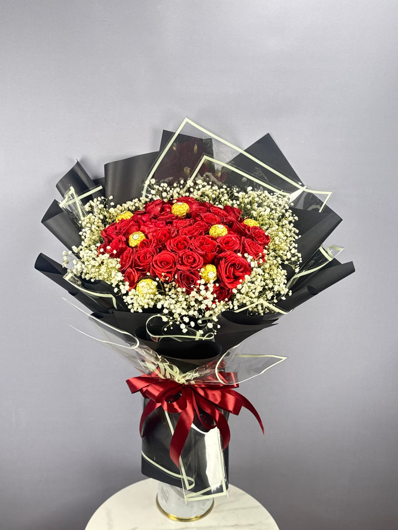 Hundred Ways to Love Rose Basket — 100 red roses, baby’s breath & Ferrero Rocher chocolates — delivery Lahore, Karachi, Islamabad