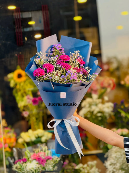 Imported purple chrysanthemums flowers bouquet designed by top florist in Lahore.