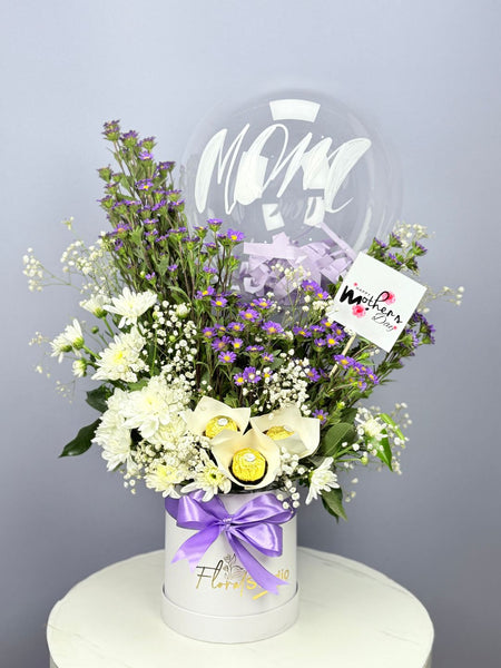 Sweet Elegance — Mom’s flower and chocolate basket with Ferrero Rocher, Craz, balloon, and Aster flowers — delivery Lahore, Karachi, Islamabad