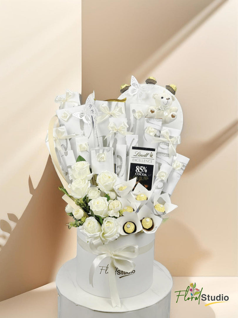 Whispers Of White hamper with Ferrero Rocher, chocolates, teddy bear, artificial flowers — delivery in Lahore, Karachi, Islamabad