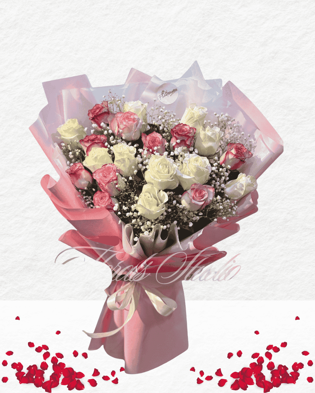 Bouquet of pink and white flowers wrapped in pink paper with a white background