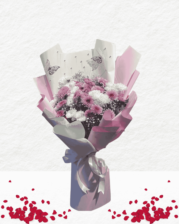 Bouquet of flowers wrapped in pink and white paper with butterfly designs on a light gray background.