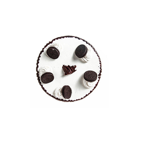 A round ice cream cake with vanilla and chocolate layers, decorated with whole Oreo cookies and chocolate pieces.