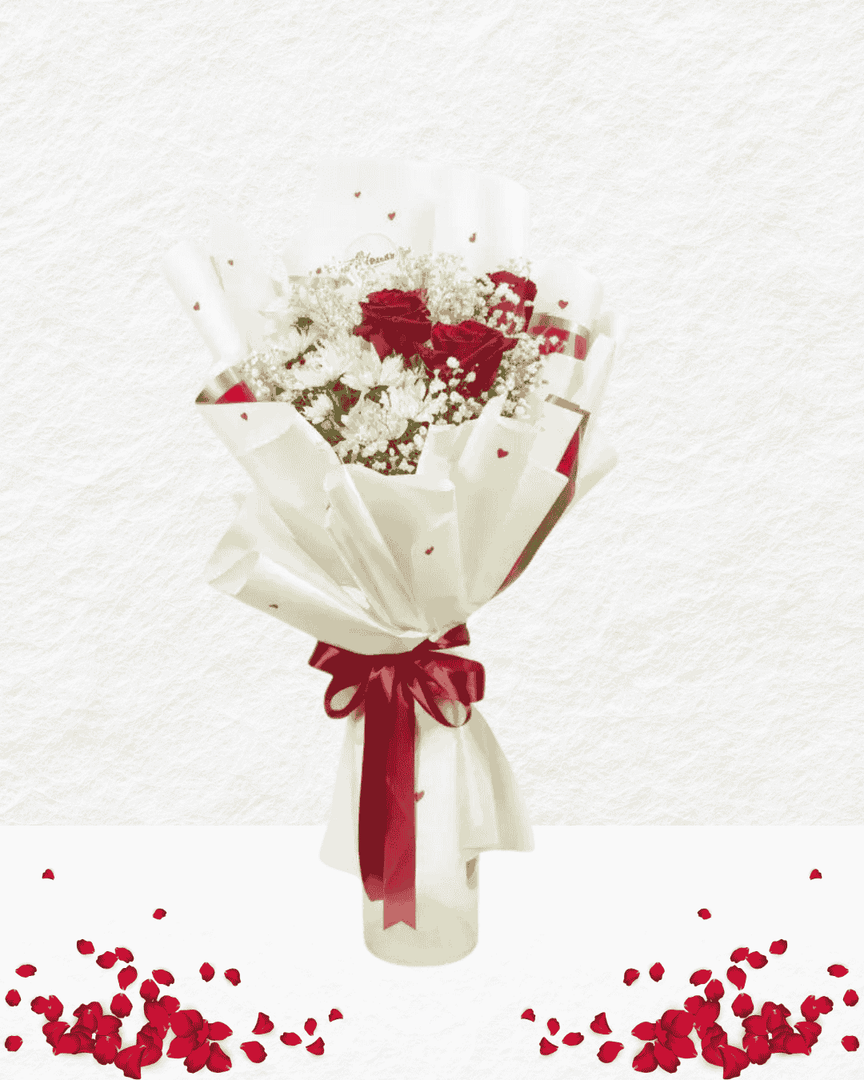 Bouquet of red and white flowers with a red ribbon on a light gray background