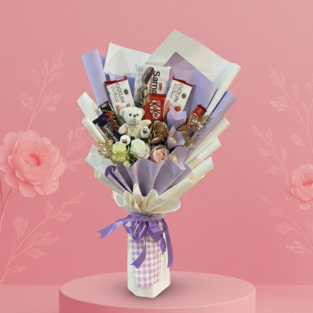 Bouquet of snacks and flowers on a pink platform with a pink background