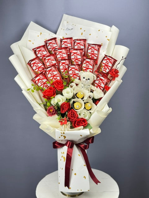KitKat Love Chocolate Basket with Teddy & Red rosses wrapped in an elegant white paper with red ribbon 

