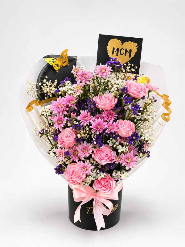 Mama Noir pink roses in a black hat box with satin ribbon