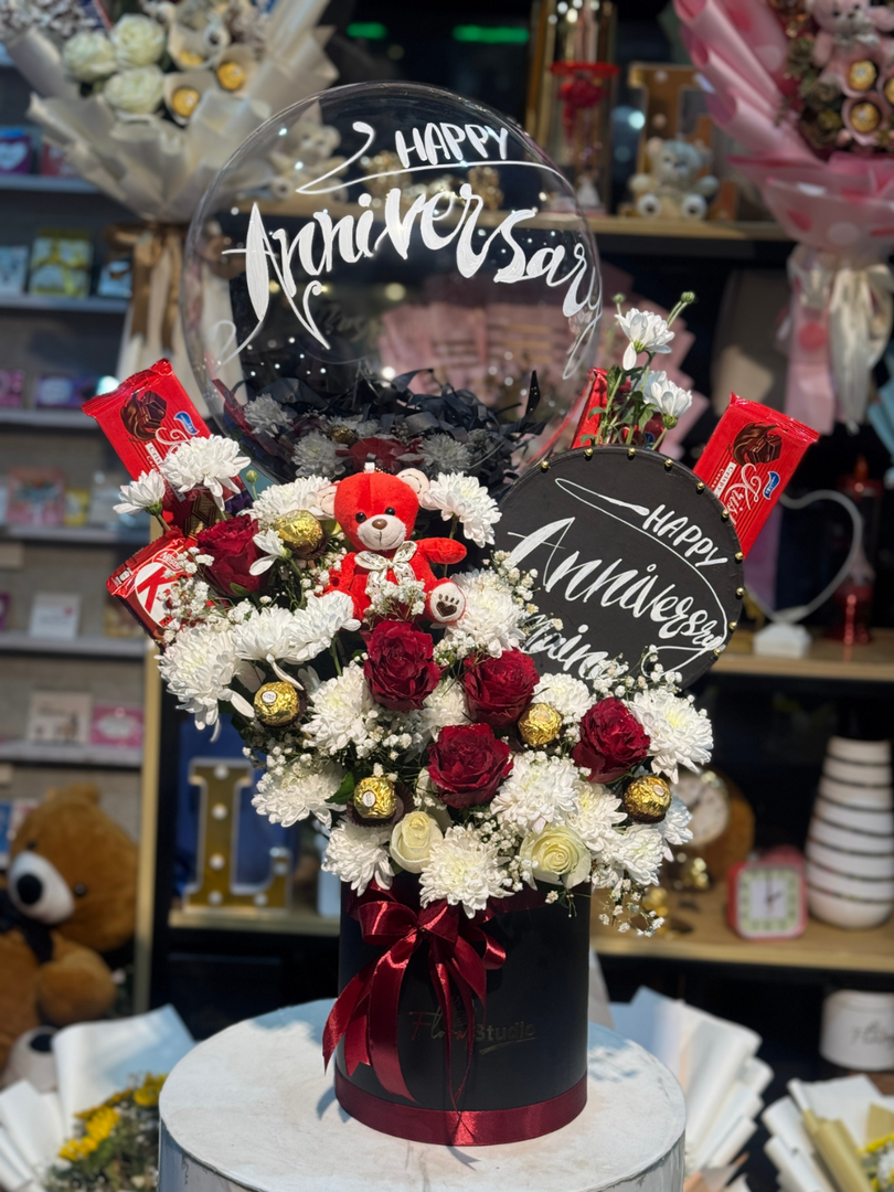 Anniversary Charm Floral Box with Roses Chrysanthemums Teddy and Chocolates Free Delivery in Gulberg Lahore


