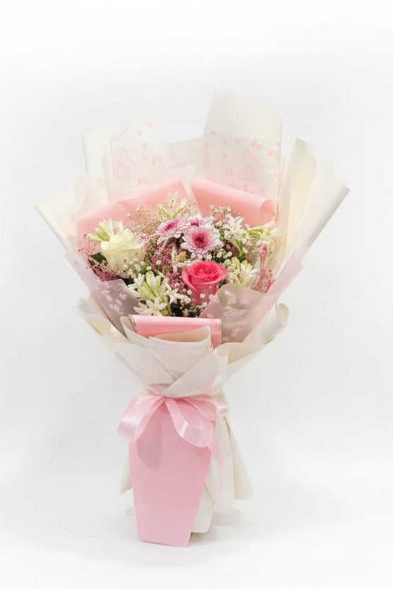 Pink and white roses with chrysanthemums and baby's breath in a hand-tied bouquet