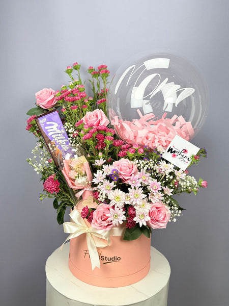 Gift Basket with Roses Chrysanthemums Balloon Chocolate and Gift Item in Pink Container Free Delivery in Model Town Lahore