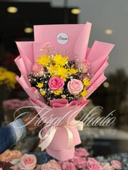 Bouquet of pink flowers wrapped in pink paper. Imported Pink rosses flower bouquet in Lahore