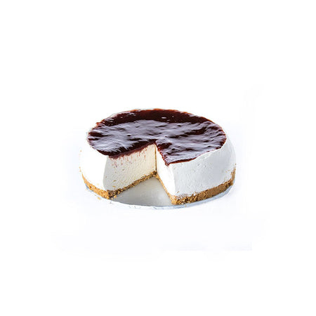 Whole strawberry cheesecake with a slice taken out on white background

