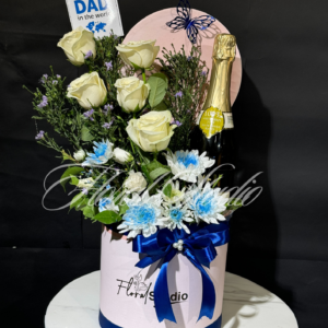 Dad's Delight floral gift arrangement with white roses, blue flowers, and champagne in a pink box with blue ribbon, perfect gift for Father's Day or special occasions